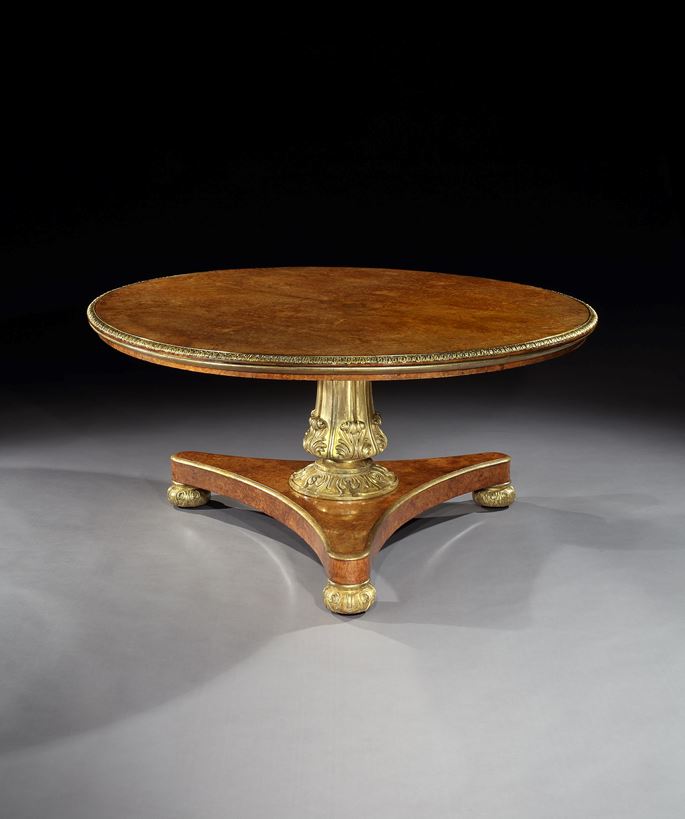William Riddle - A GEORGE IV BRASS MOUNTED PARCEL GILT AMBOYNA CENTRE TABLE | MasterArt